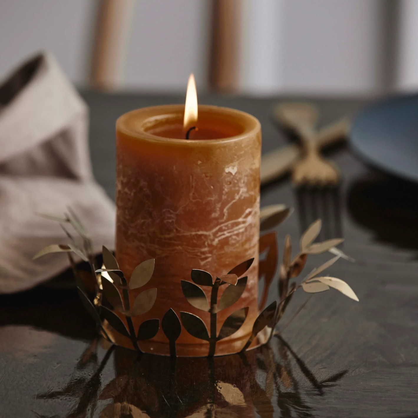 Metallic branch stencil candle holder