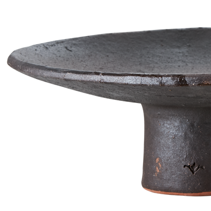 Wooden black tray on pedestal