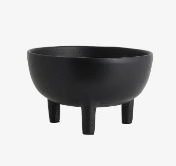 Large black bowl with three legs