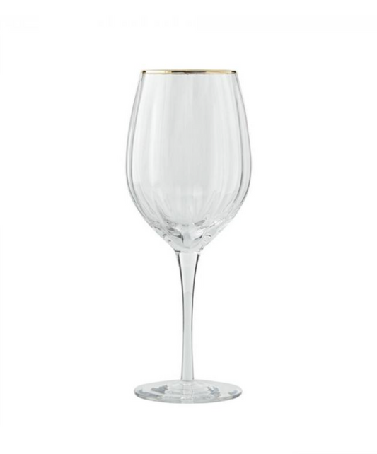 Gold-rimmed red wine glass